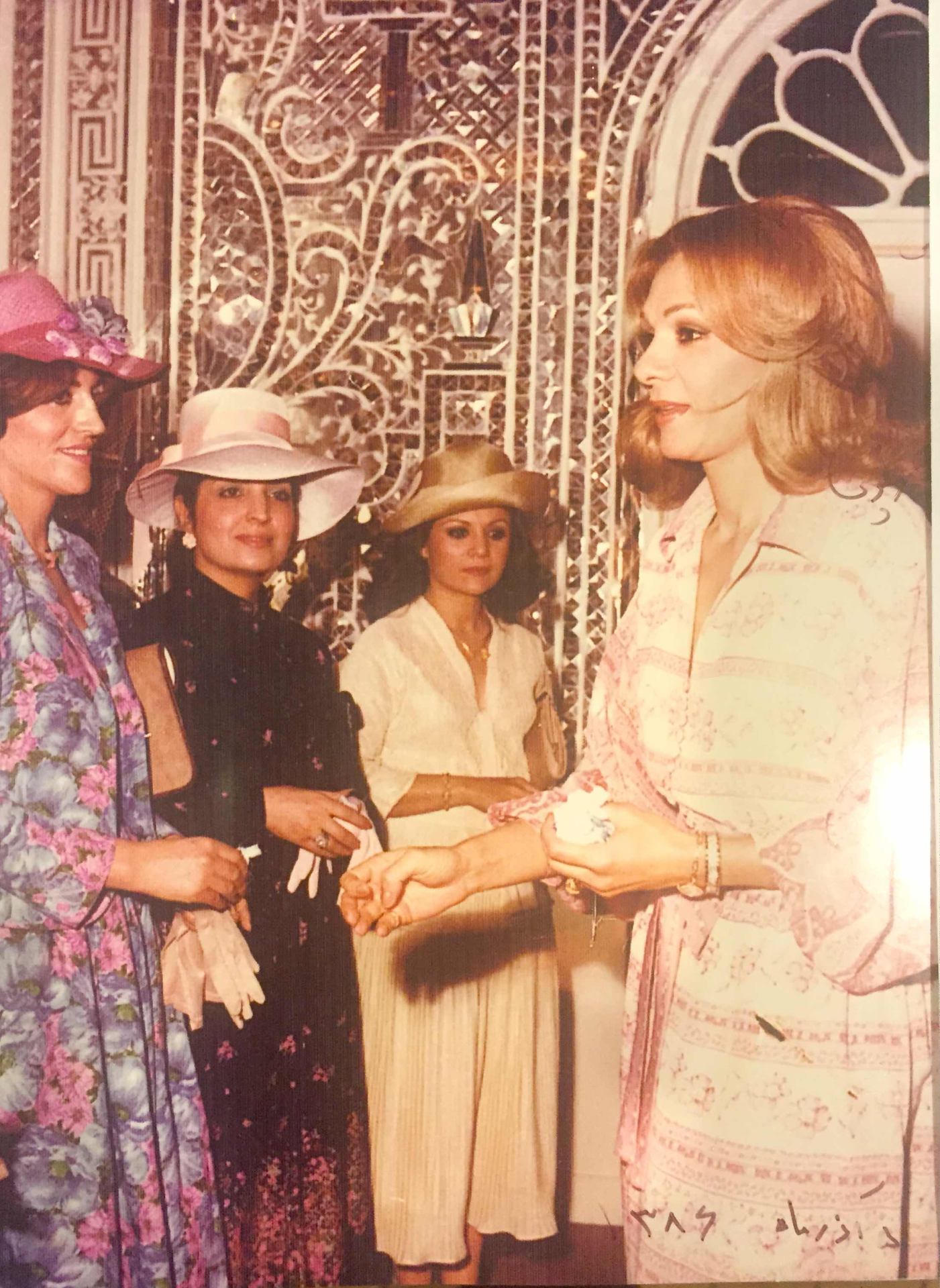Mahin, second from left, with Empress Farah Pahlavi in the Imperial Court of Iran, late 1970s
