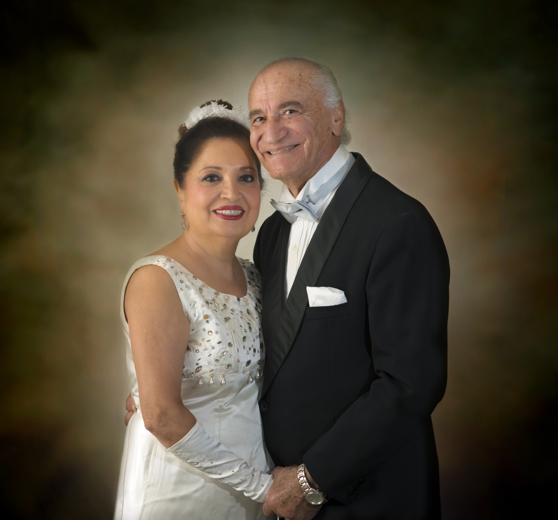 Mahin and Parviz Huschmand decades later, wearing the same outfits from their wedding day